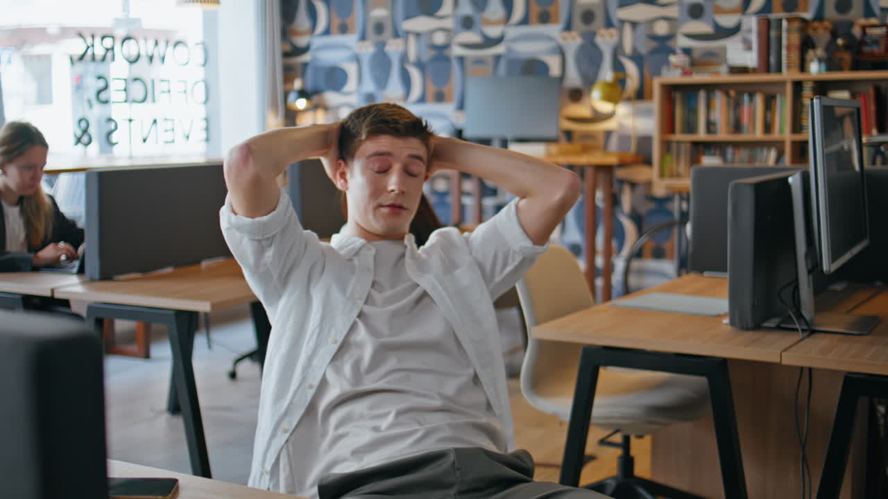 Office man resting workplace at buro agency closeup. Tired guy enjoying break