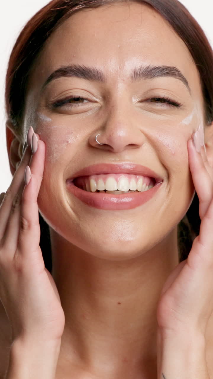 Woman Applying Skincare Product to Her Face