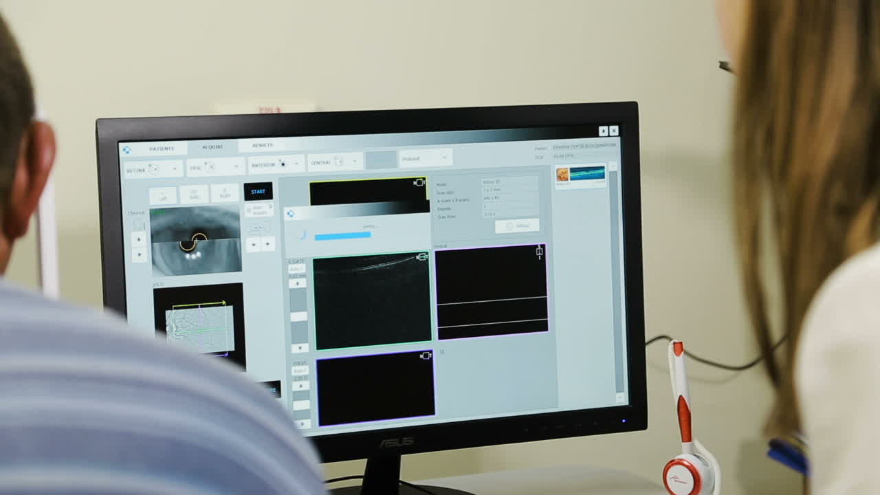 Patient having eye examination. Ophthalmologist measuring intraocular pressure of man in clinic