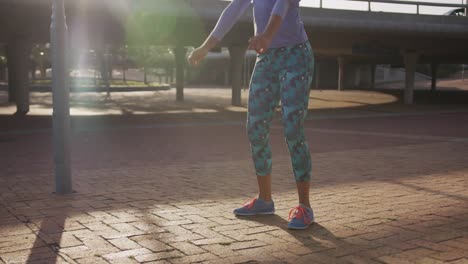 Caucasian-woman-doing-squats-in-a-park