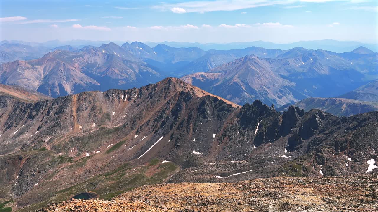 Summer Oxford Harvard Columbia Huron Peak Collegiate Peaks hiking trail La Plata Peak Sawatch Range Rocky Mountains top of summit 14er Colorado drone blue sky clouds haze pan left motion