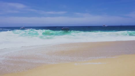 boats on the horizon line on the coast of cabo san lucas, baja california