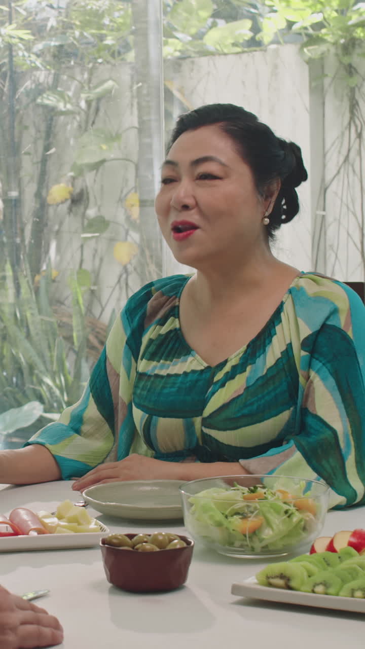 Elderly Asian Woman Having Dinner with Her Husband