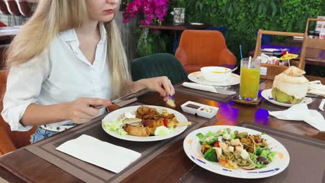 woman eating at a buffet restaurant