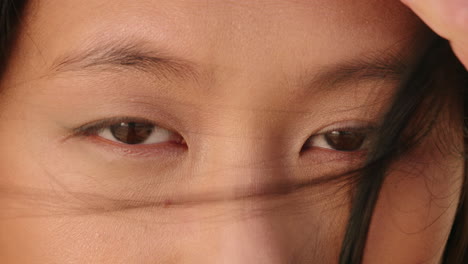 close-up-macro-eyes-of-beautiful-asian-woman-looking-pensive-healthy-eyesight-concept