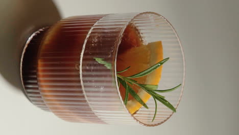 Vertical-Video-orange-espresso-refreshing-summer-drink-in-beautiful-drinking-glass