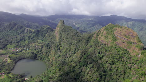 san carlos with lush greenery, a volcanic crater lake, and mountain ridges, aerial view