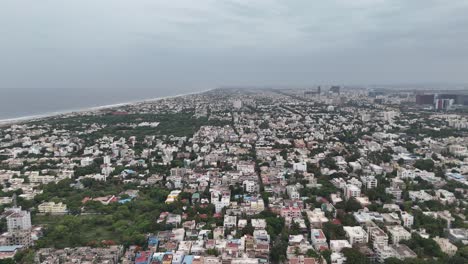 drone footage showing lush greenery near the beach in besant nagar