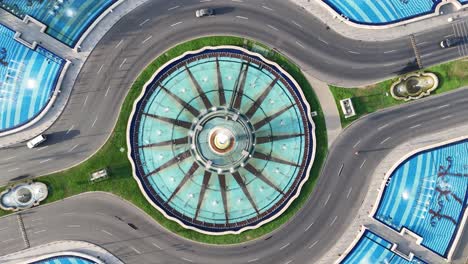 Rotating-Birds-Eye-View-Of-The-Artesian-Fountains-Of-Unirii-Square,-Empty-Streets,-Bucharest,-Romania