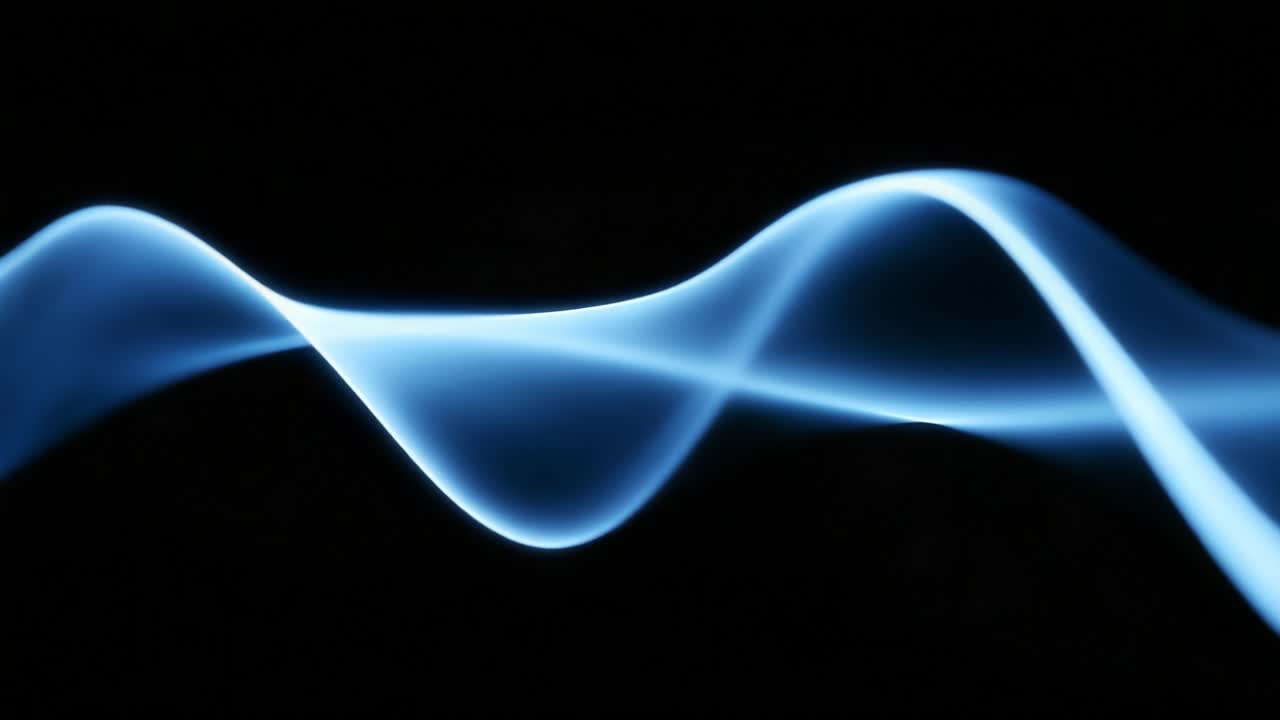 Fluid Dynamics and Light: Exploring the Ethereal Waves in Motion Captured in Two Frames, Conveying the Beauty of Flowing Forms in Vibrant Blue Against a Mysterious Black Background