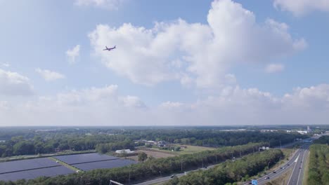 Airplane-in-the-sky-passing-by-above-a