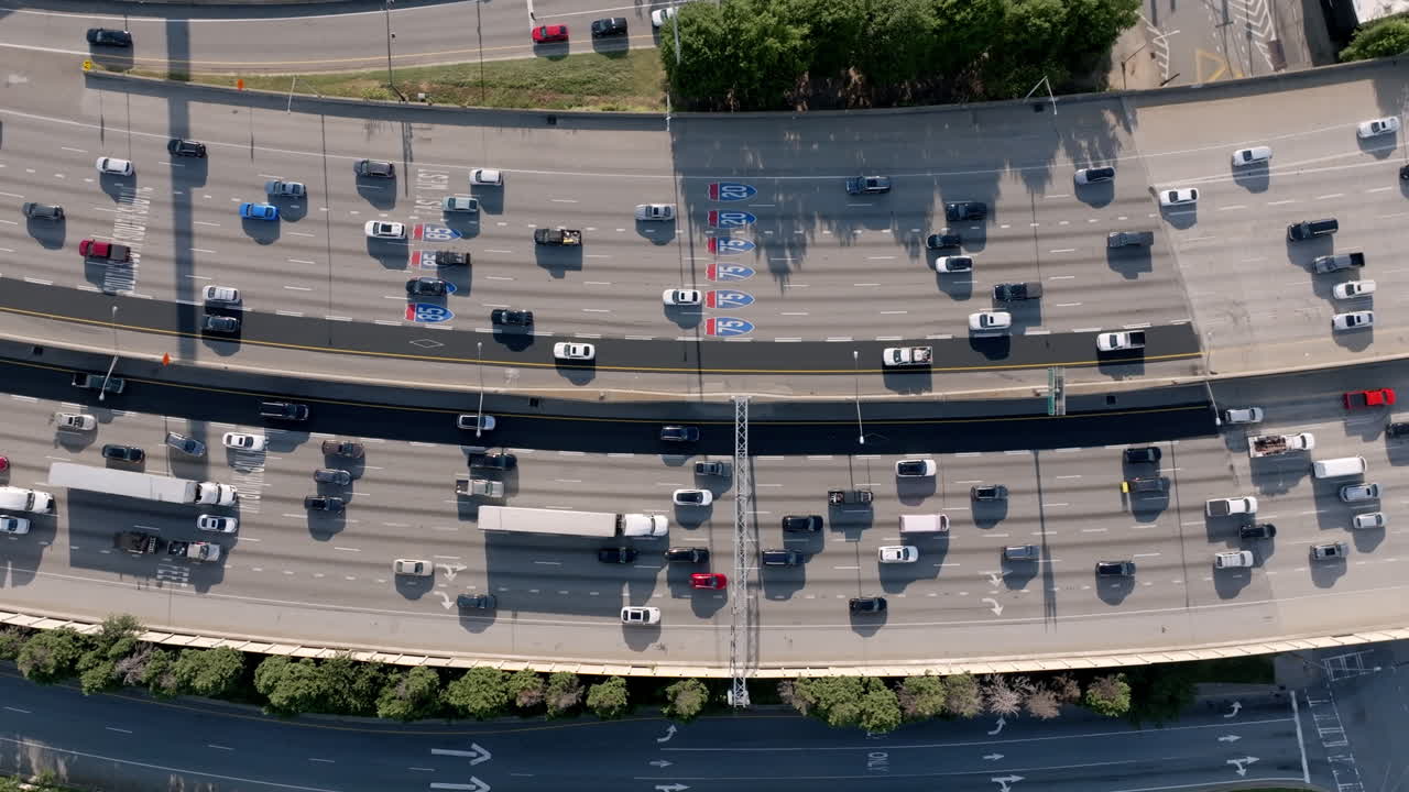 Overhead view of busy Atlanta highway with multiple lanes filled with cars and trucks