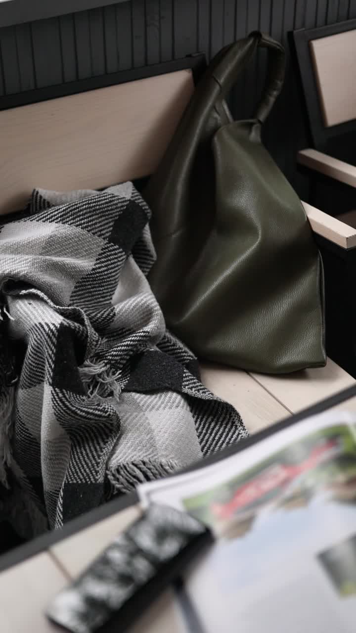 Cozy Cafe Setting with Blanket and Bag
