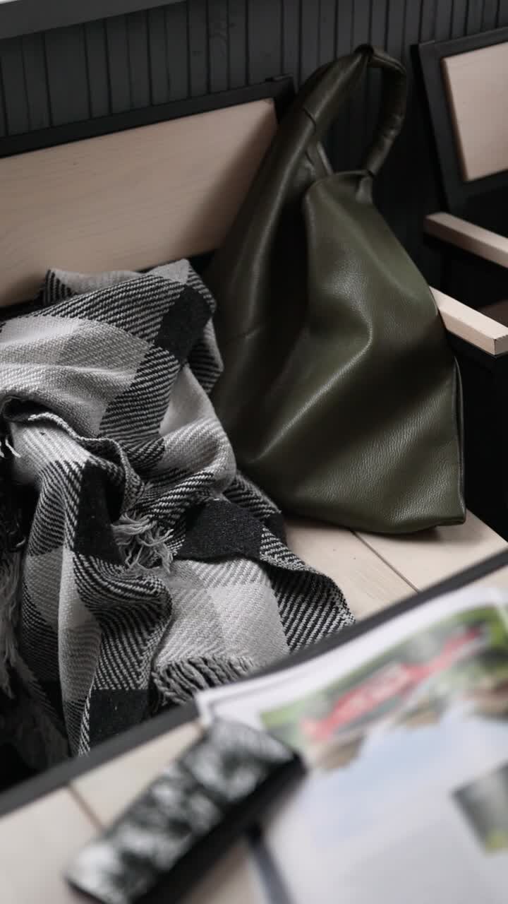 Cozy Cafe Setting with Blanket and Bag