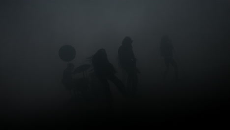 musical group silhouette in smoke at studio. rock band concert. rock music show