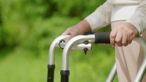 elderly person using walker outdoors