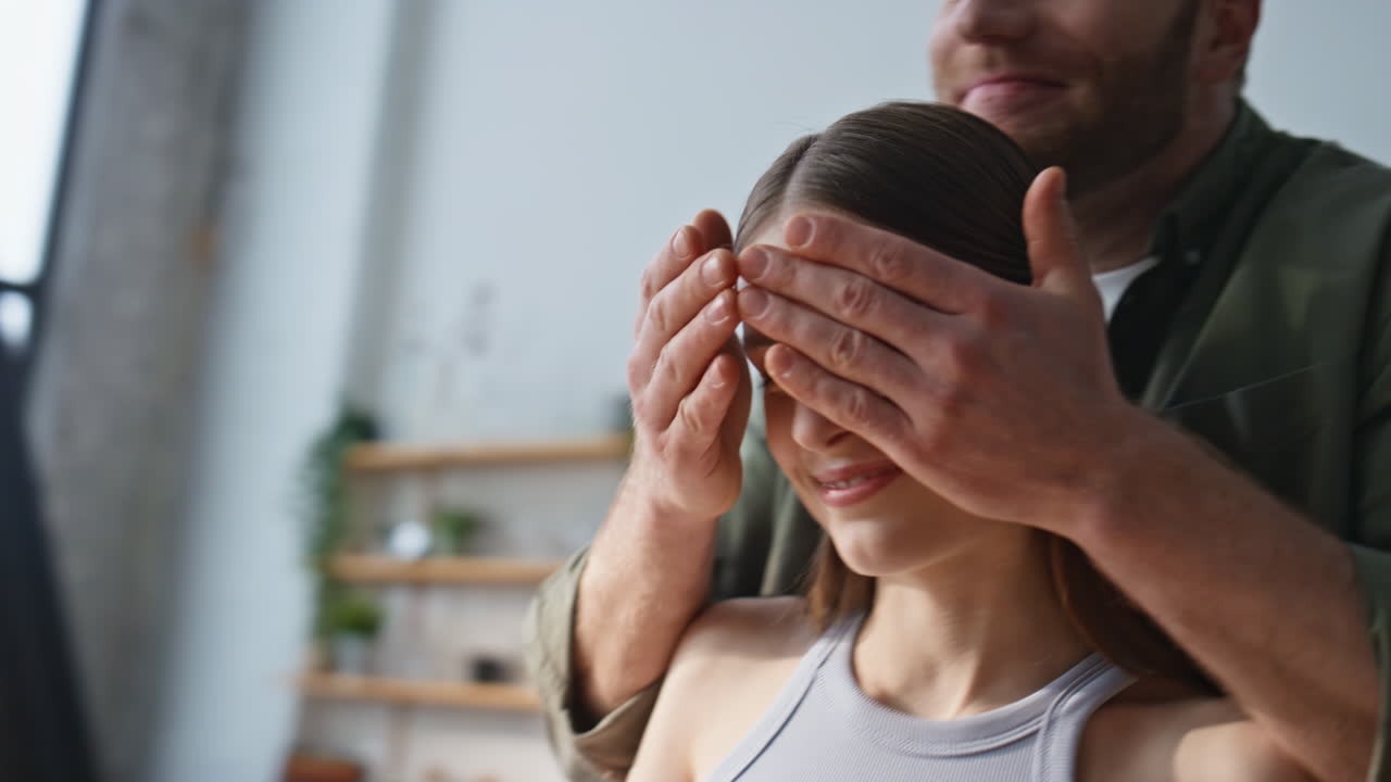 Lovely pair cooking together in modern kitchen closeup. Happy man and woman