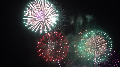 Firework-display-at-night-on-sky-background