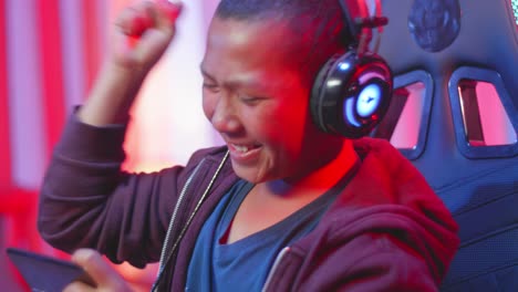 teenager playing mobile game