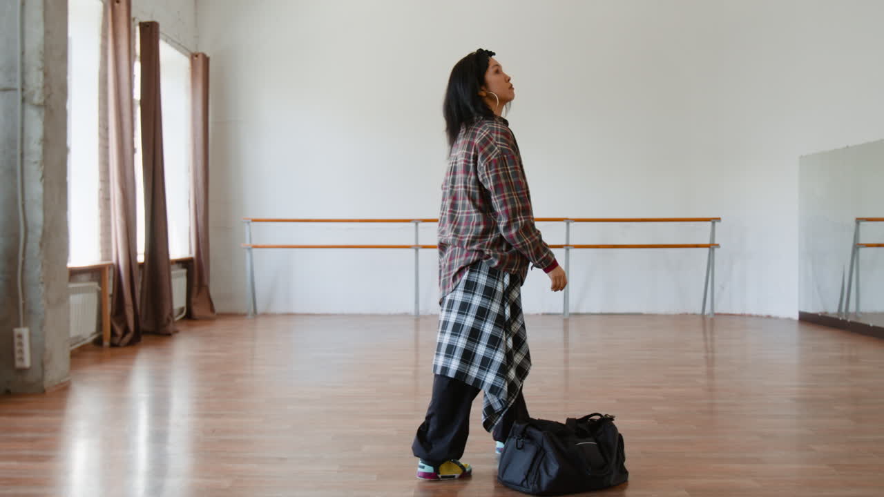 Person arriving at a dance studio