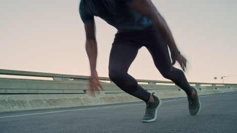 fitness, sprint and black man running in the road