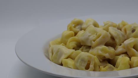 tortellini alla panna in a white dish