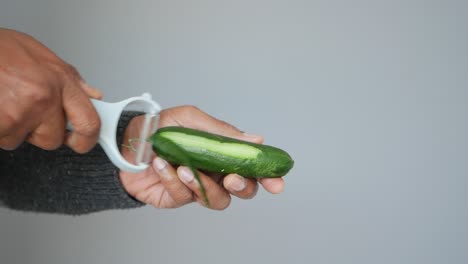 peeling a cucumber