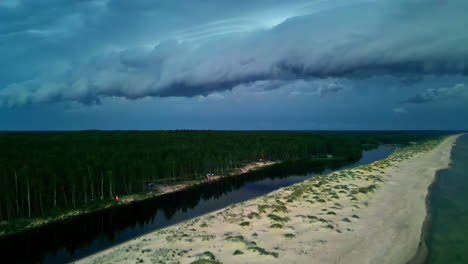 aerial view of a coastal landscape under dramatic storm clouds