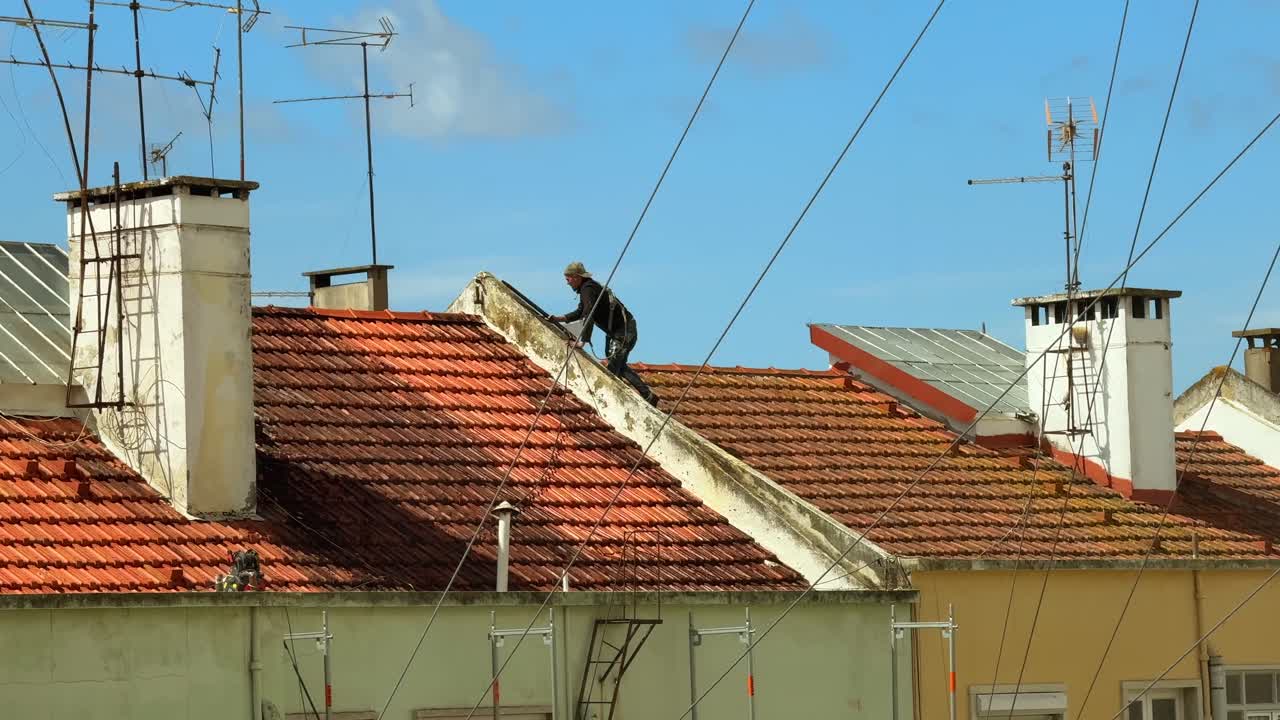 Rooftop Worker on Terracotta Tile Roofs