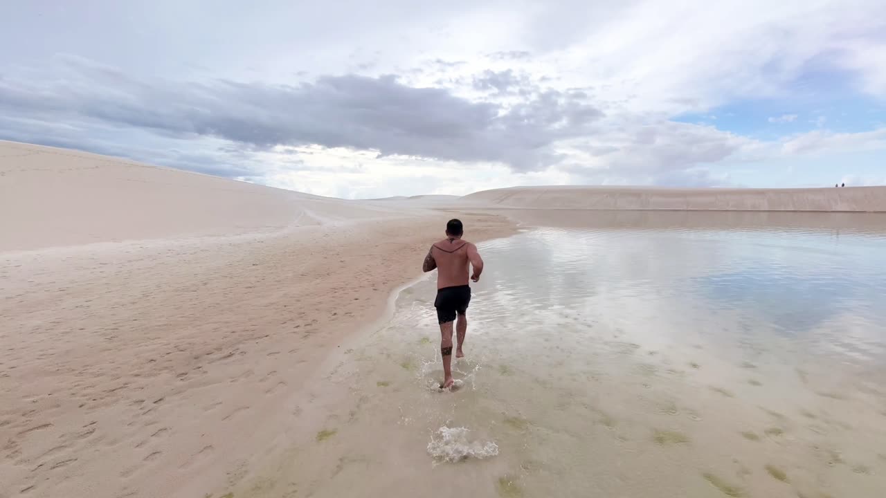 running inside the lagoa bonita of the maranhenses lencois