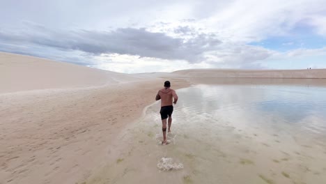 running inside the lagoa bonita of the maranhenses lencois