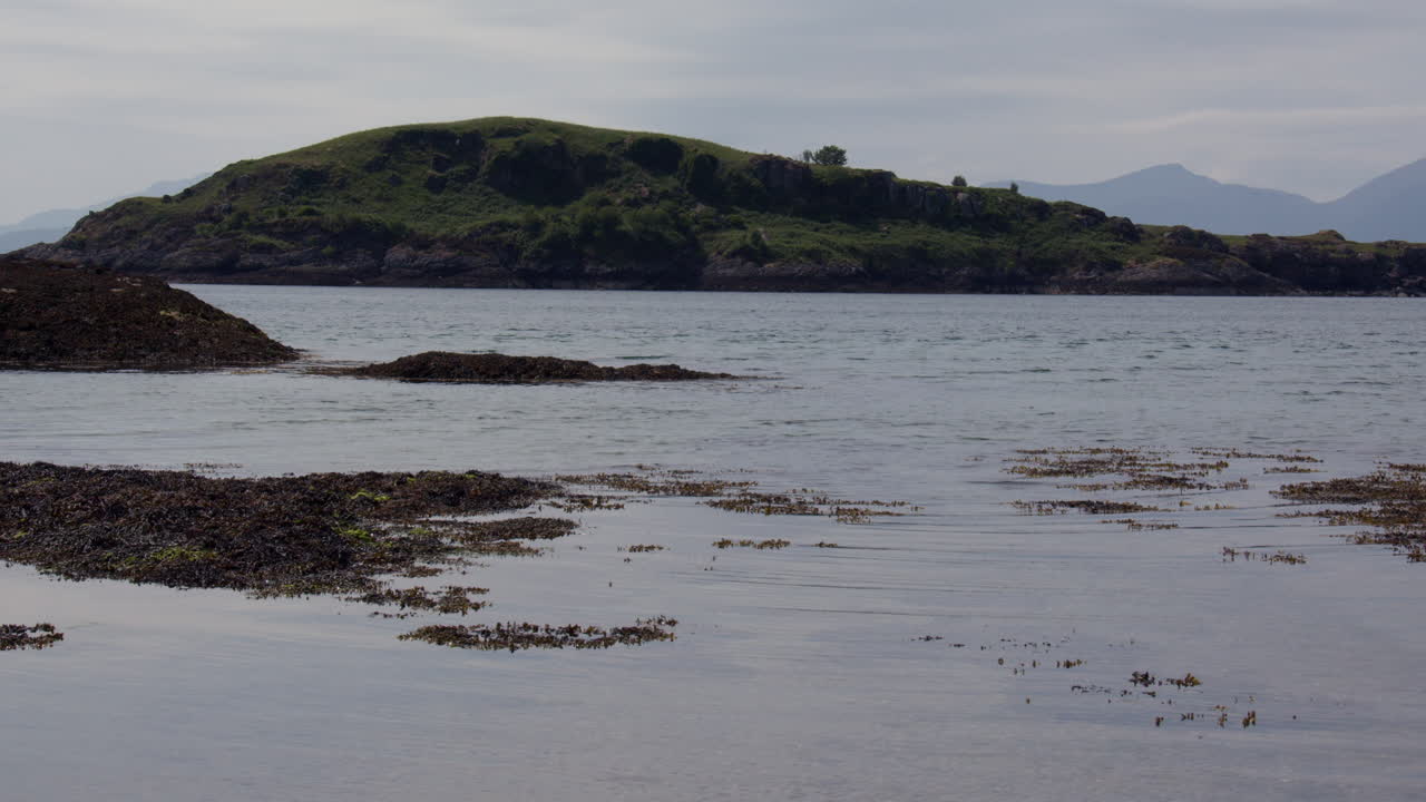 Shot of Maiden Island at Little Ganavan beach, at Oban