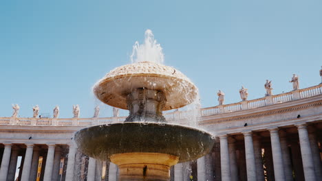 steadicam shot: the famous fountain of san pietro italian square with saint peter church columns in rome italy