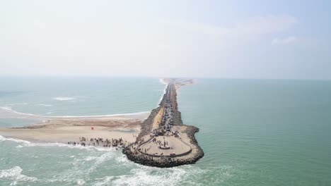 breathtaking aerial drone shot of dhanushkodi, featuring the historic last road leading to the edge of india.