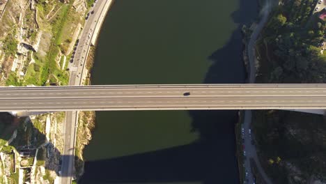 aerial birdseye view above long straight porto bridge crossing douro river looking down