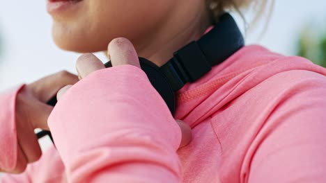 Handheld-view-of-woman-choosing-the-best-song-for-running