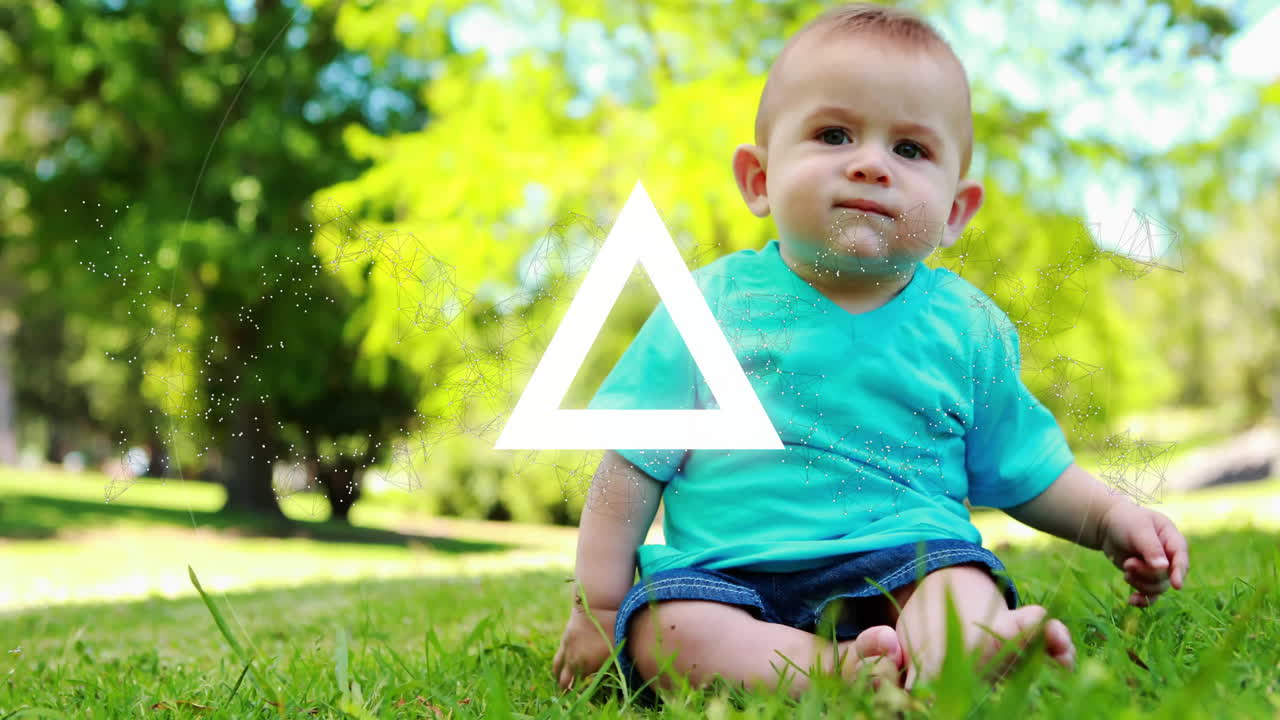 Auf Gras sitzendes Baby mit Dreieck und Netzwerkanimierung