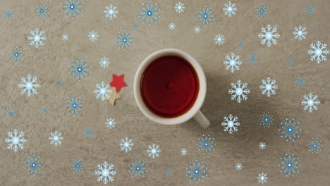 animación de la nieve cayendo sobre la taza de té de navidad.
