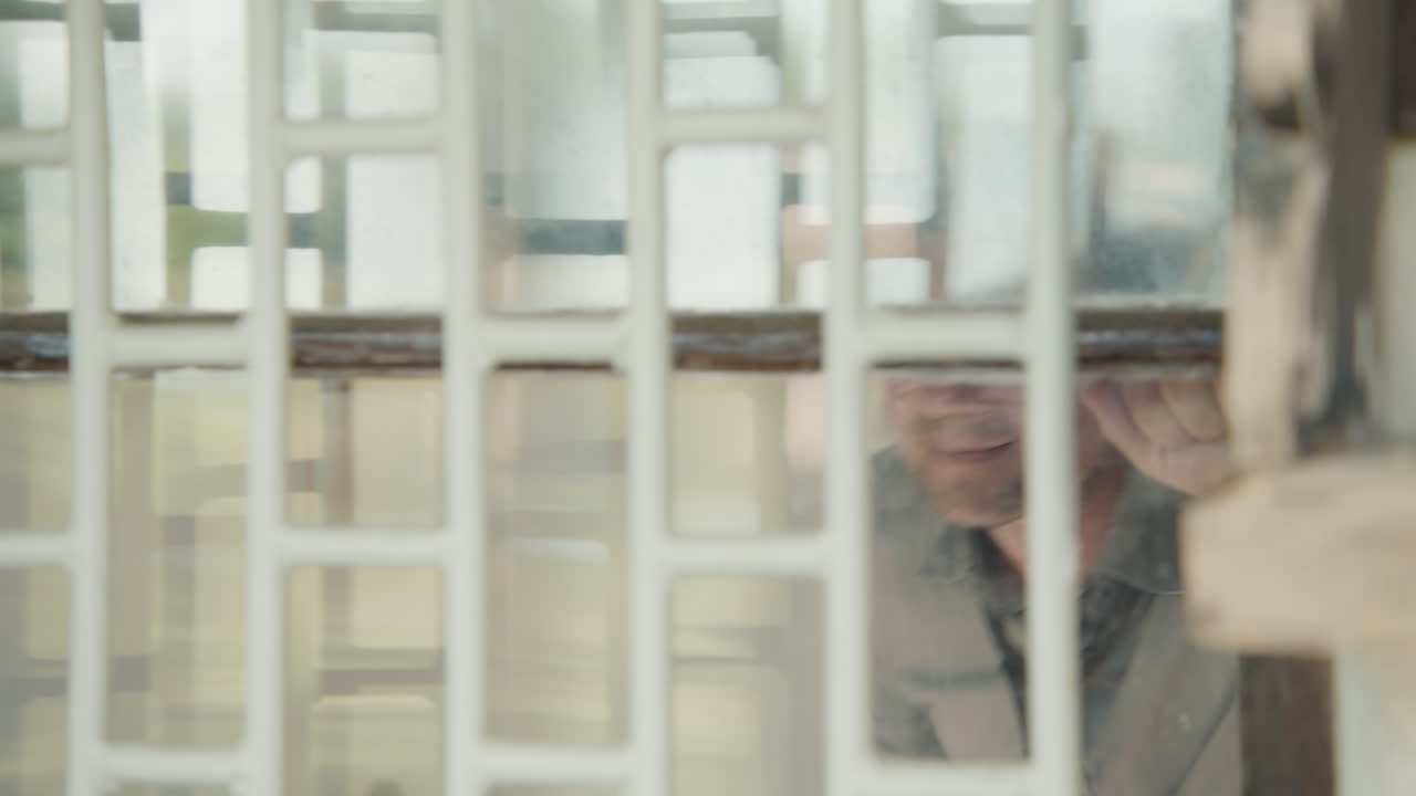 Person Looking Through a Window Grid