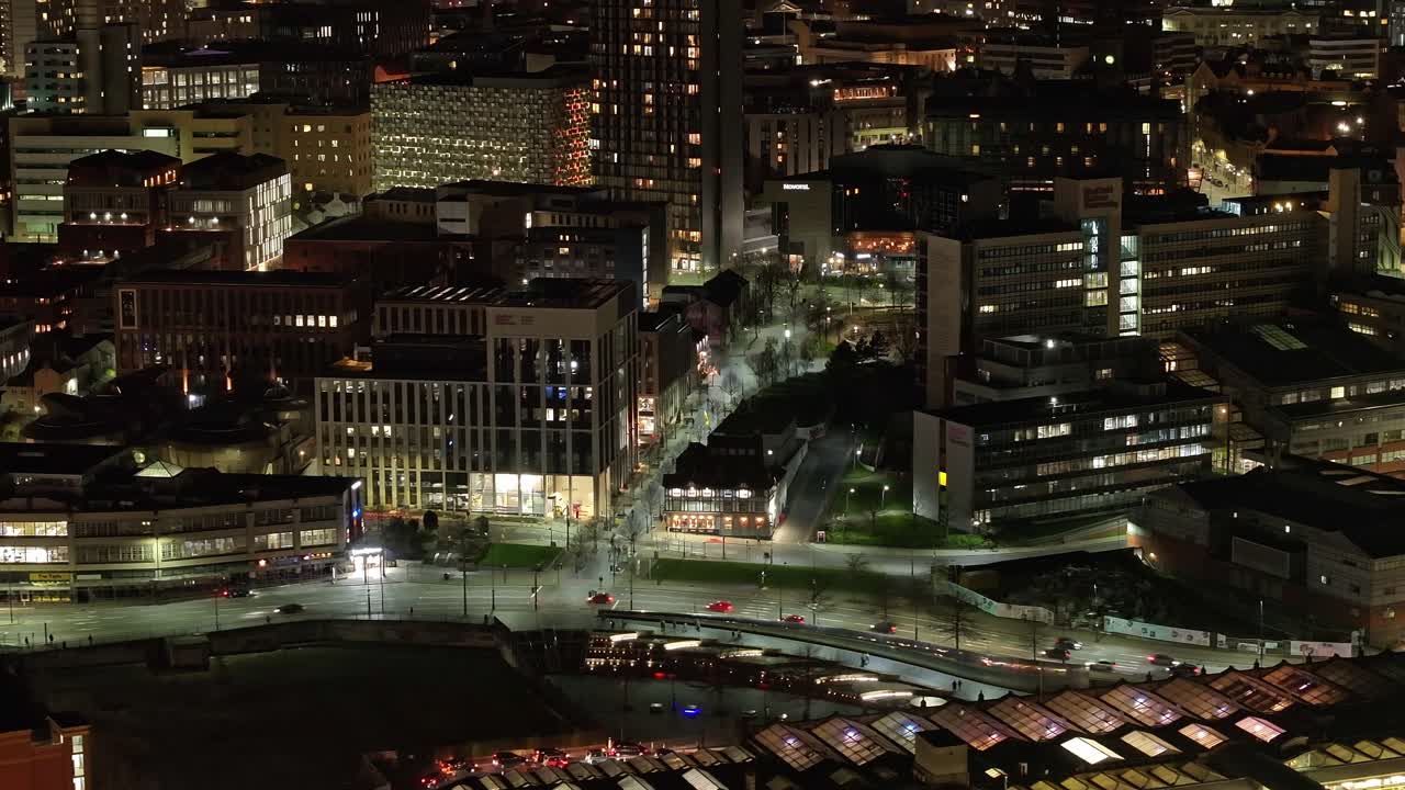 Wide aerial of street traffic at night in Sheffield city centre, UK