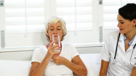 mature woman taking medication