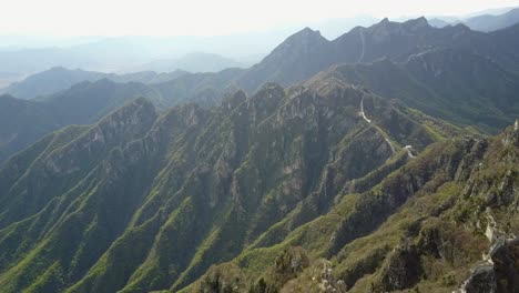 wild, remote section of great wall of china on jagged mountain ridge