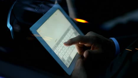 businessman using laptop in a car 4k