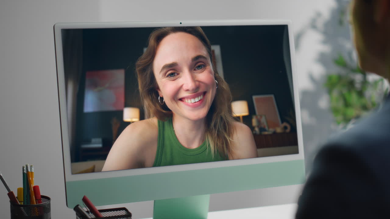 Woman on a video call using a desktop computer