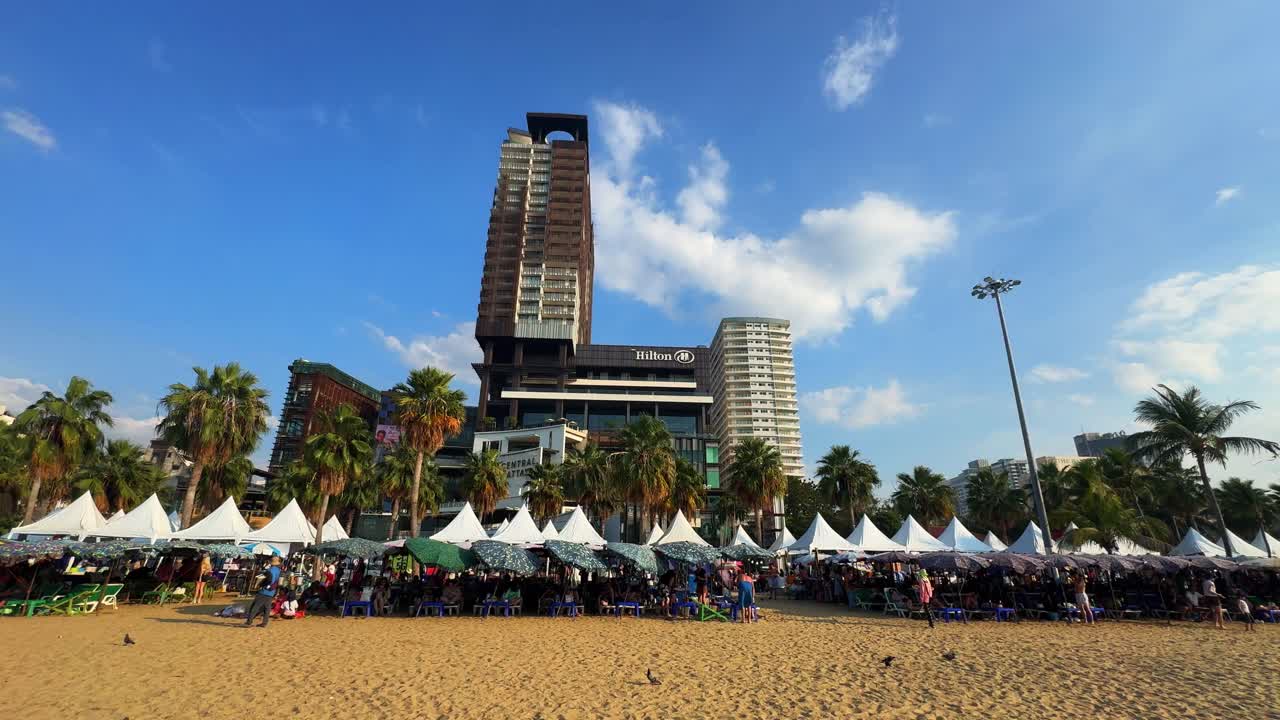 Hilton hotel building view Pattaya beach in Thailand, holiday party city