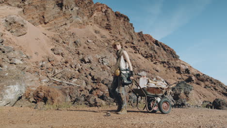 woman walking with cart in post apocalyptic world