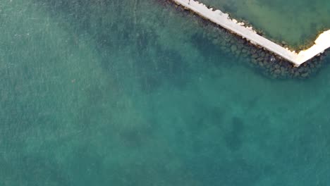 Aerial-top-view-of-the-sea-fortress-of-Bourtzi,-in-Nauplio,-Greece-|-4K