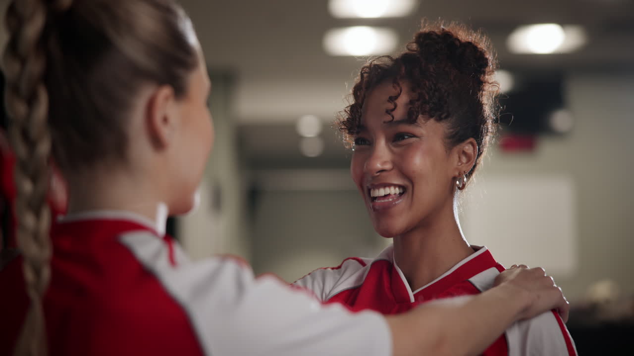 Teammates celebrate in the locker room