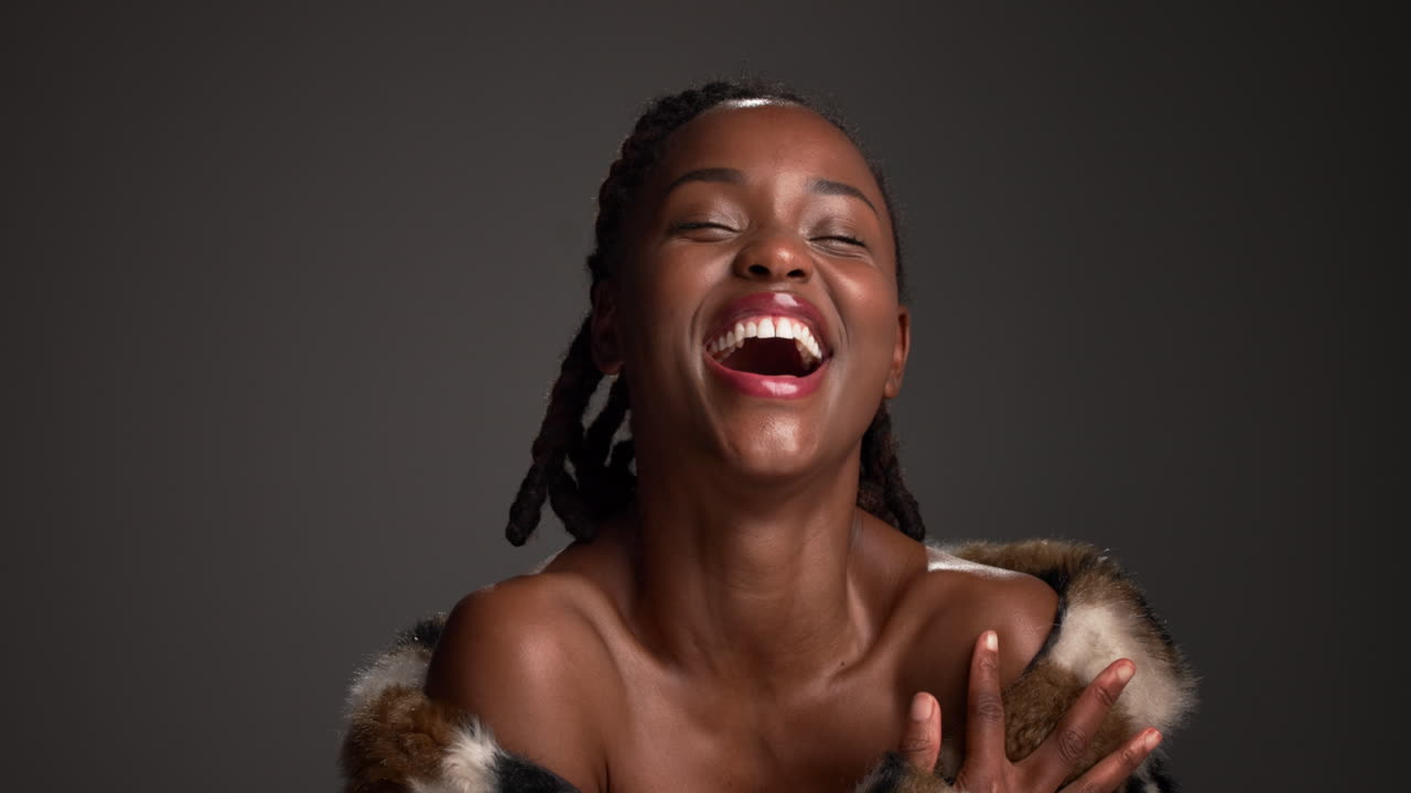 Portrait of a laughing woman in fur coat