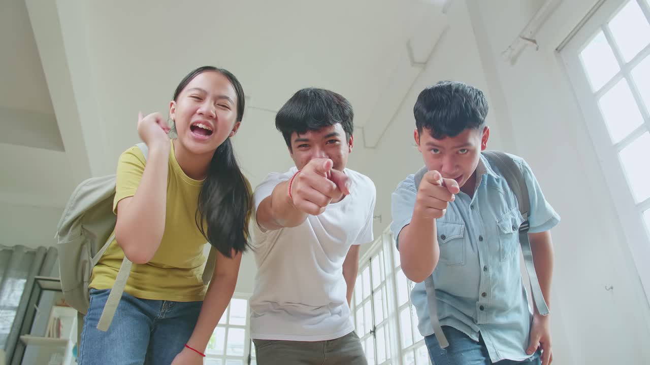 Asian Students At High School Bullying At The Camera